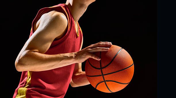 istock Basketball player close up with ball focus and emotional concentration 2238310383