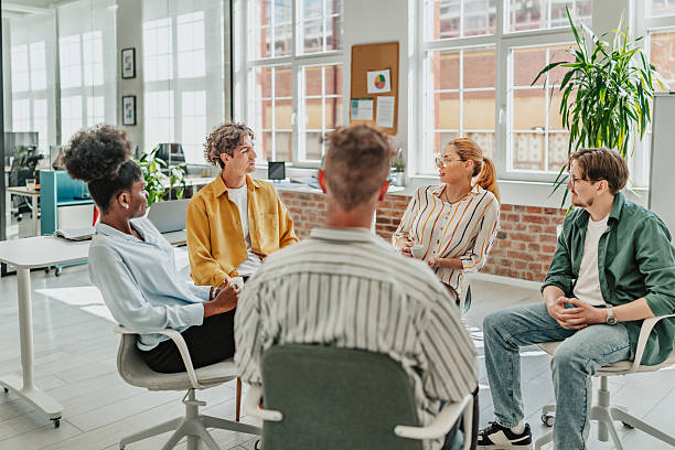 istock Young professionals engage in a collaborative team meeting in a modern office environment 2238310871
