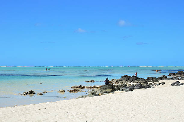 Island Cerf, Mauritius - May 01, 2013: People have a rest on the beach of small tropical island of Cerf, Mauritius island