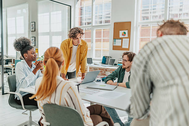 istock Young professionals engaged in teamwork and brainstorming in a modern office space during the workday 2238314244