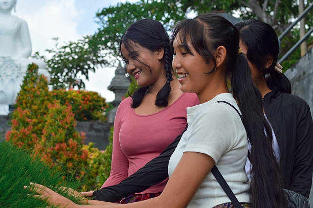 istock Group of girls exploring temple plants with curiosity 2238315308