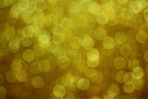 Christmas bokeh background with small yellow glitters