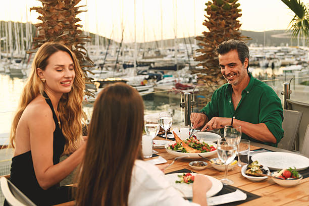 istock Family Dining at Marina Restaurant at Sunset 2238320763