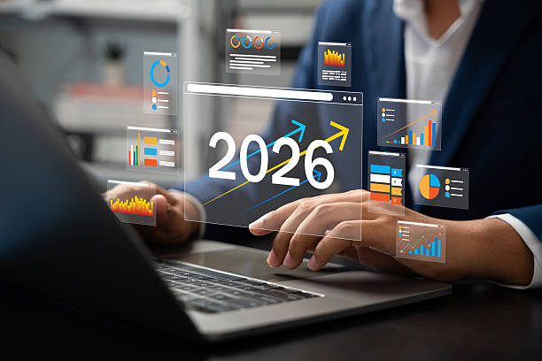 istock 2026 Goals, Businessman analyzing futuristic dashboard data with growth charts and financial projections for year 2026, showing digital trends, strategy planning, Target, investment insights. 2238324635