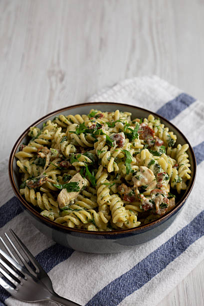 istock Homemade Chicken Spinach Alfredo Rotini Pasta in a Bowl, side view. 2238325638