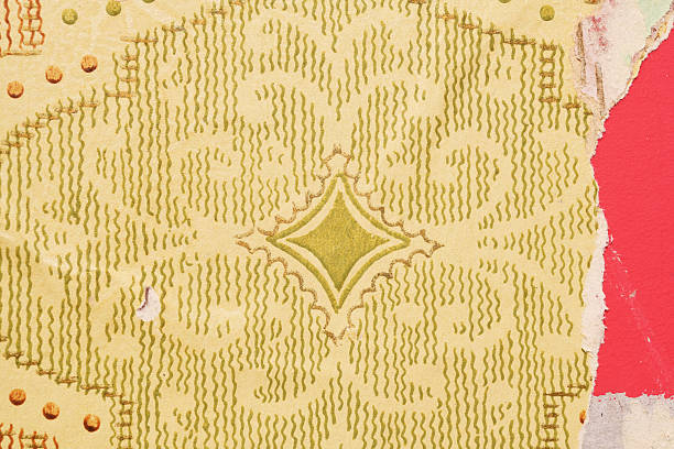 Old wallpaper on the wall. Old torn wallpaper for texture or background