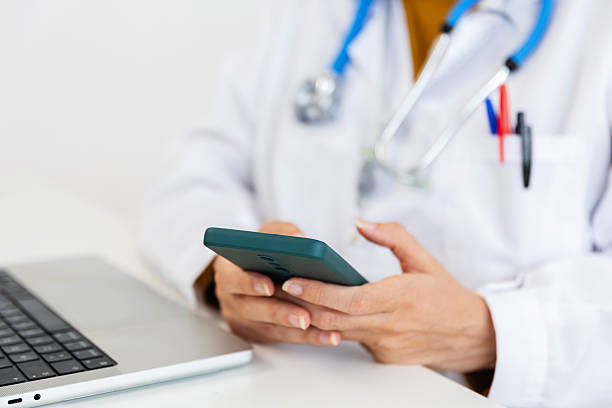istock Doctor using smartphone for telehealth consultation 2238332825