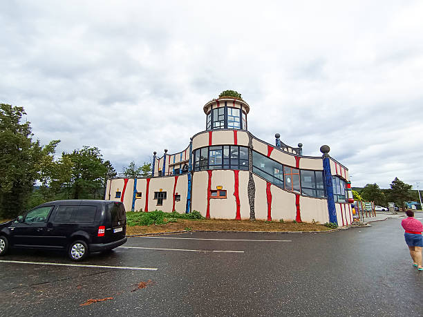 Austria, Vienna, Bad Fischau- 8 July 2025: McDonald's building cafe. Friedensreich Hundertwasser Gingerbread House. Technical service station. Roadside restaurant. Bad Fischau-Brunn
