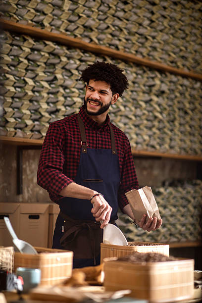 istock Happy Artisan Preparing Specialty Bagged Products in Rustic Warehouse Setting 2238334492