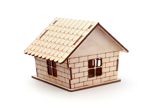 istock Wooden toy house isolated on white. 2238335750