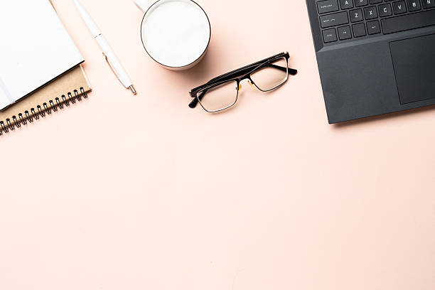 istock Office workspace flat lay background. Laptop, notebook, coffee cup and glasses. 2238338400