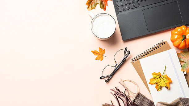 istock Autumn office. Autumn flat lay background. Laptop, notepad, coffee cup and fallen leaves. 2238338416