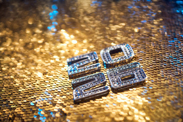 istock Sparkling Silver 2026 New Year Numbers on Golden Sequin Celebration Background 2238339359