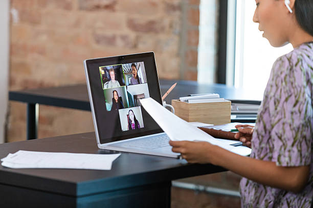 istock Young woman participates in a video conference call with colleagues discussing a project. 2238346468
