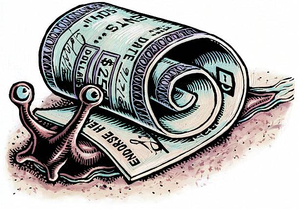 Paper bank check rolled up to form a snail's shell