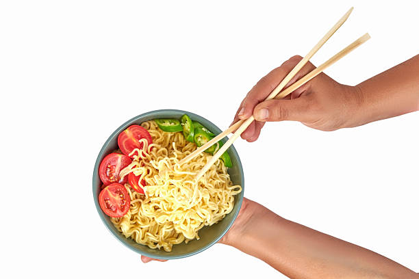 istock Hand Holding Noodles In Bowl And Chopsticks On White Bacground 2238350721