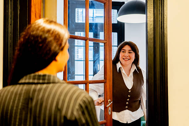 istock Psychologist greeting patient for therapy session 2238354403