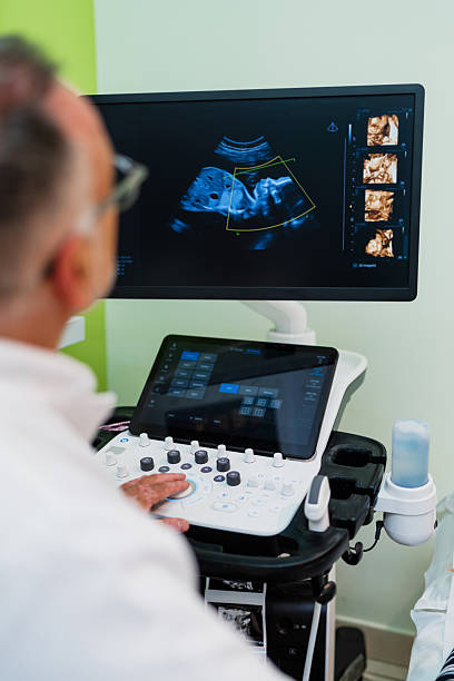 istock Experienced doctor working on 4d ultrasound device during medical pregnancy checkup 2238354479