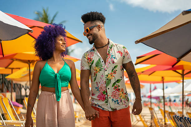 istock Afro couple holding hands on the beach 2238358722