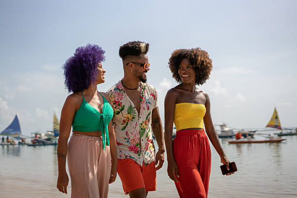 istock Afro friends walking on Porto de Galinhas beach 2238358750