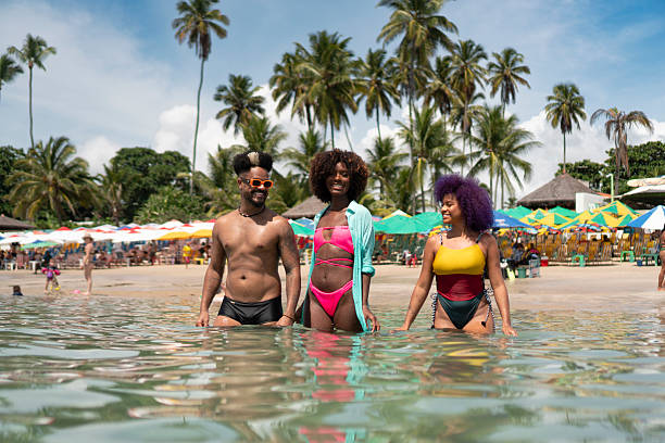 Afro tourists on Porto de Galinhas beach in Pernambuco, Brazil