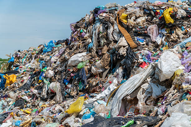 istock A large mound of waste is visible under a clear sky, filled with plastic bags and discarded materials at a landfill site 2238360036