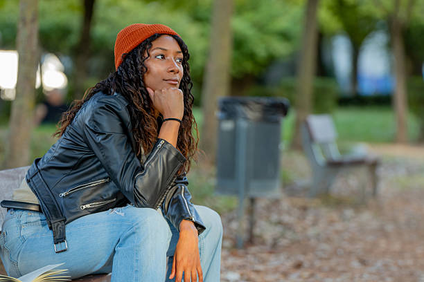 istock young woman sitting thoughtfully outdoors in autumn 2238363448