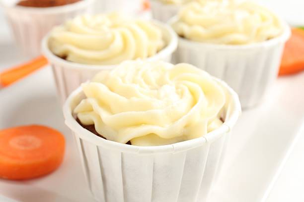 Carrot cheese cake ready for easter. Close up of carrot cheese cake square. Selective focus.
