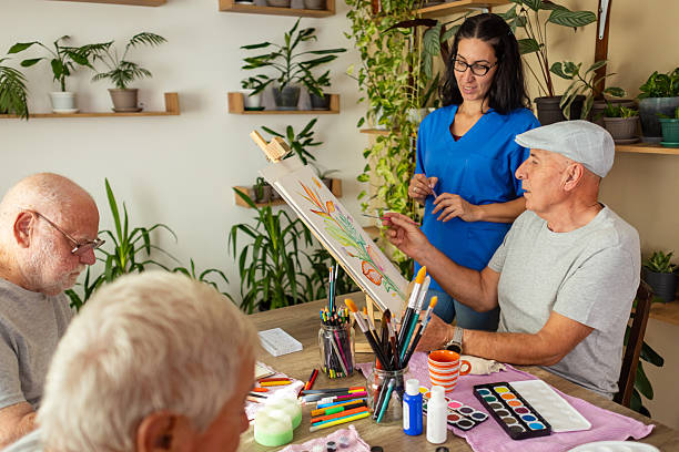 istock Elderly people painting together 2238370470