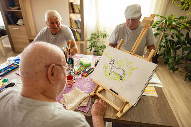 istock Group of elderly men painting together 2238370638