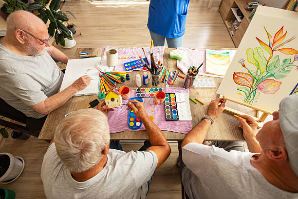 istock Elderly men painting in art class 2238370811