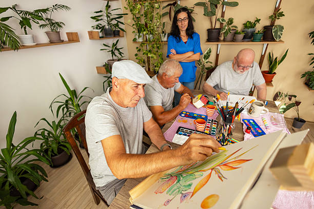 istock Senior painting with caregiver support 2238370826