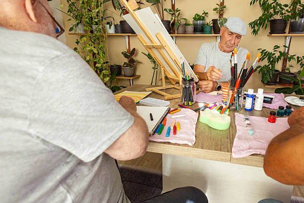 istock Creative seniors enjoying painting 2238374234