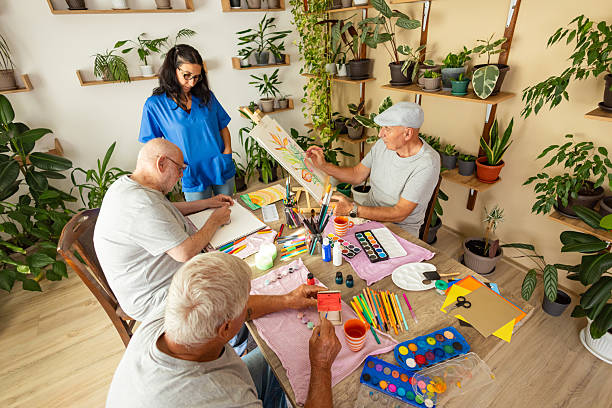 istock Creative seniors enjoying painting 2238374237