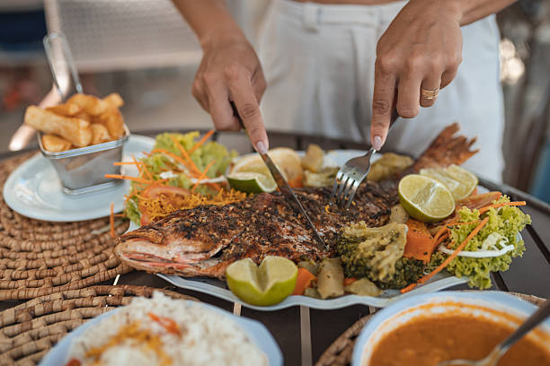 istock Hand-cutting fish in a tropical restaurant 2238374850