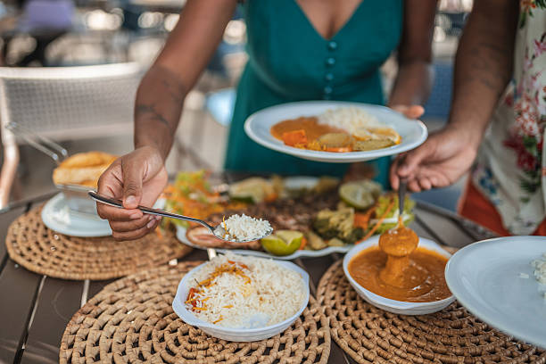 istock Hands serving each other in a tropical Brazilian restaurant 2238374852