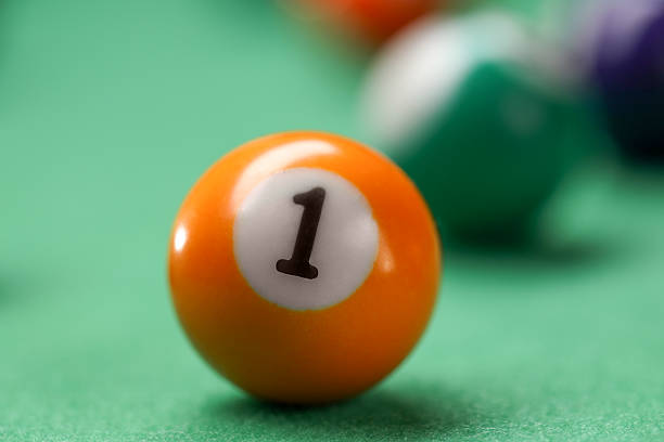Billiard ball on green table, closeup view