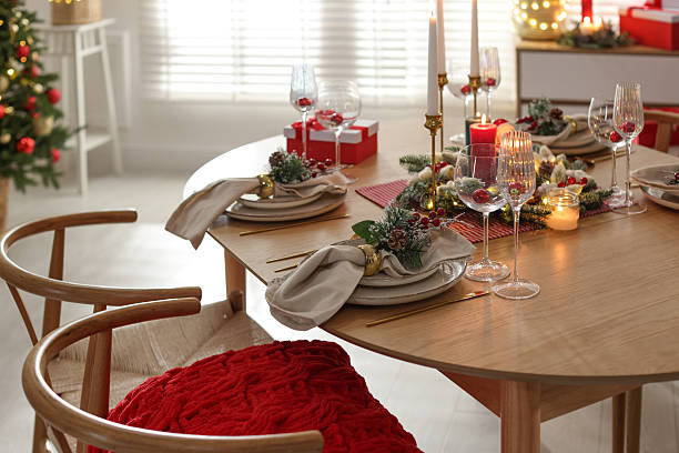 istock Christmas celebration. Festive table setting with dishware, glasses and decor in room 2238378157