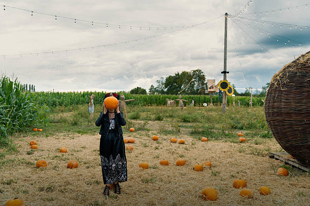 istock Halloween Costume with Pumpkin Covering Face 2238381639