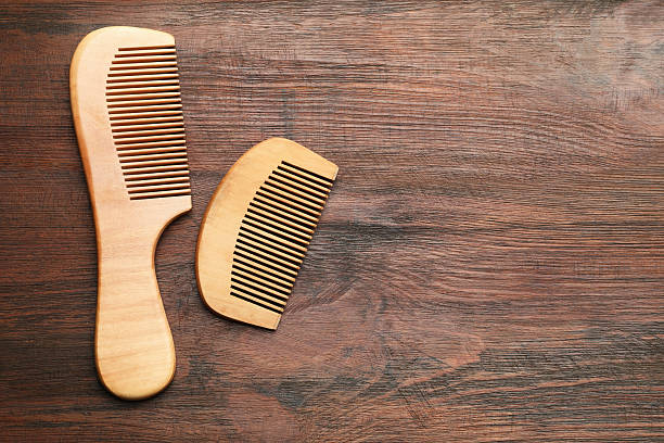 istock Different hair combs on wooden background, top view. Space for text 2238382388