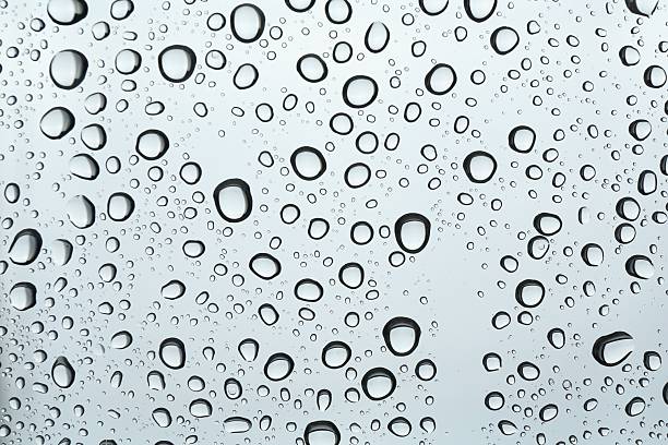 istock Many water drops on light glass surface, closeup 2238383026