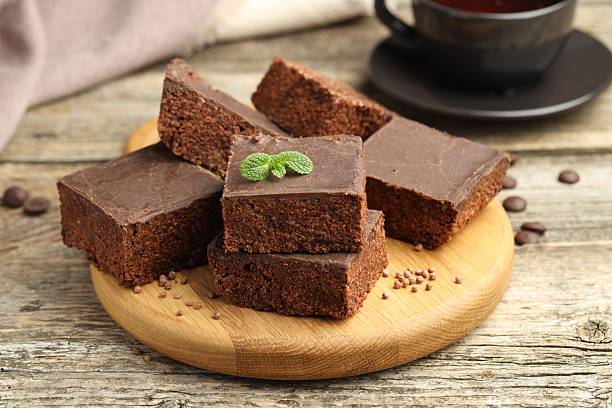 istock Delicious chocolate puffed rice bars and mint on wooden table, closeup 2238384220