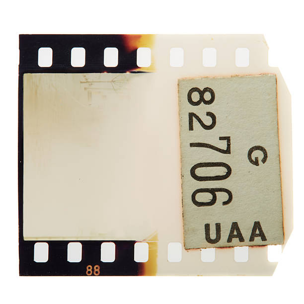 First of the roll. Vintage blank photograpic slide frame with light leak and burn effects. Noise, grain and scratches