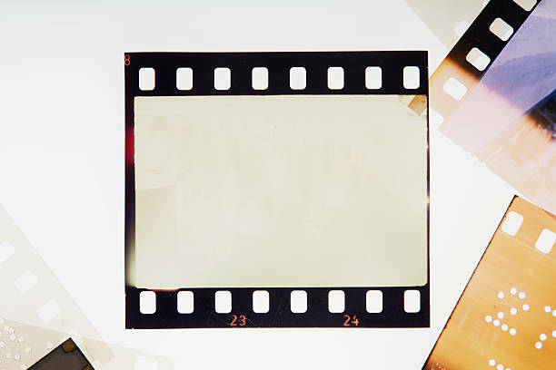 istock Blank vintage film negative surrounded with blank frames. Noise, grain and scratches 2238384504