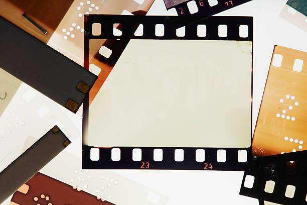 istock Blank vintage film negative surrounded with blank frames. Noise, grain and scratches 2238384531