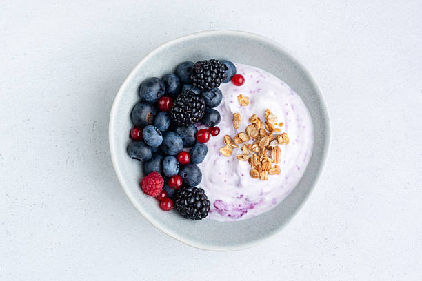 istock Berry yogurt bowl with granola topping 2238387466