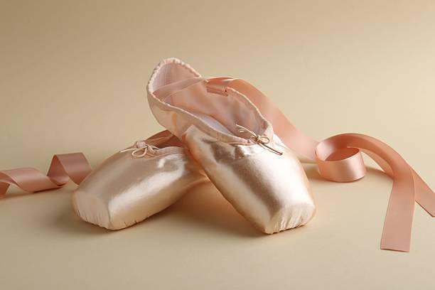 istock Pair of beautiful pointe shoes on beige background 2238388720