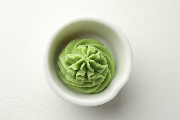 istock Hot wasabi paste in bowl on white table, top view 2238389261