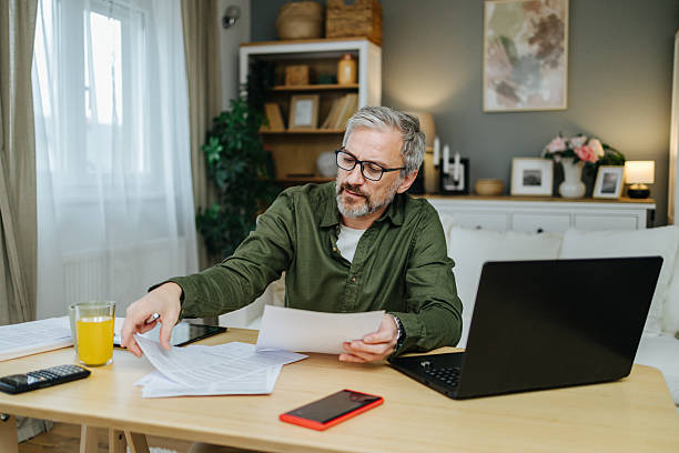 istock Mid adult man managing home finances and remote work 2238389531