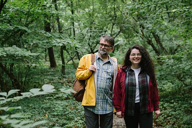 istock Father and daughter enjoying forest hiking adventure 2238390593